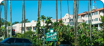 Luxurious street scene in Beverly Hills with high-end shops, palm trees, and upscale vibe for BUR to Beverly Hills car service.