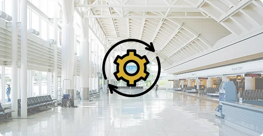Modern airport terminal with beams, windows, seating, and baggage claim, overlaid with a golden gear icon encircled by arrows, symbolizing efficiency and system updates.