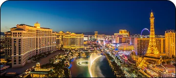 An aerial view of the Las Vegas Strip, with The Eiffel Tower replica visible.