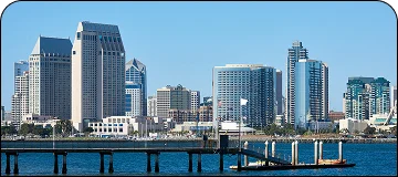 A scenic view of the San Diego skyline and harbor on a sunny day.
