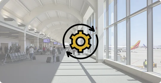 Inside view of SNA airport terminal showing passenger movement and airplance visible outside the windows.